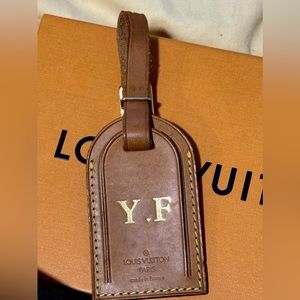 Louis Vuitton luggage tag in good condition with initials